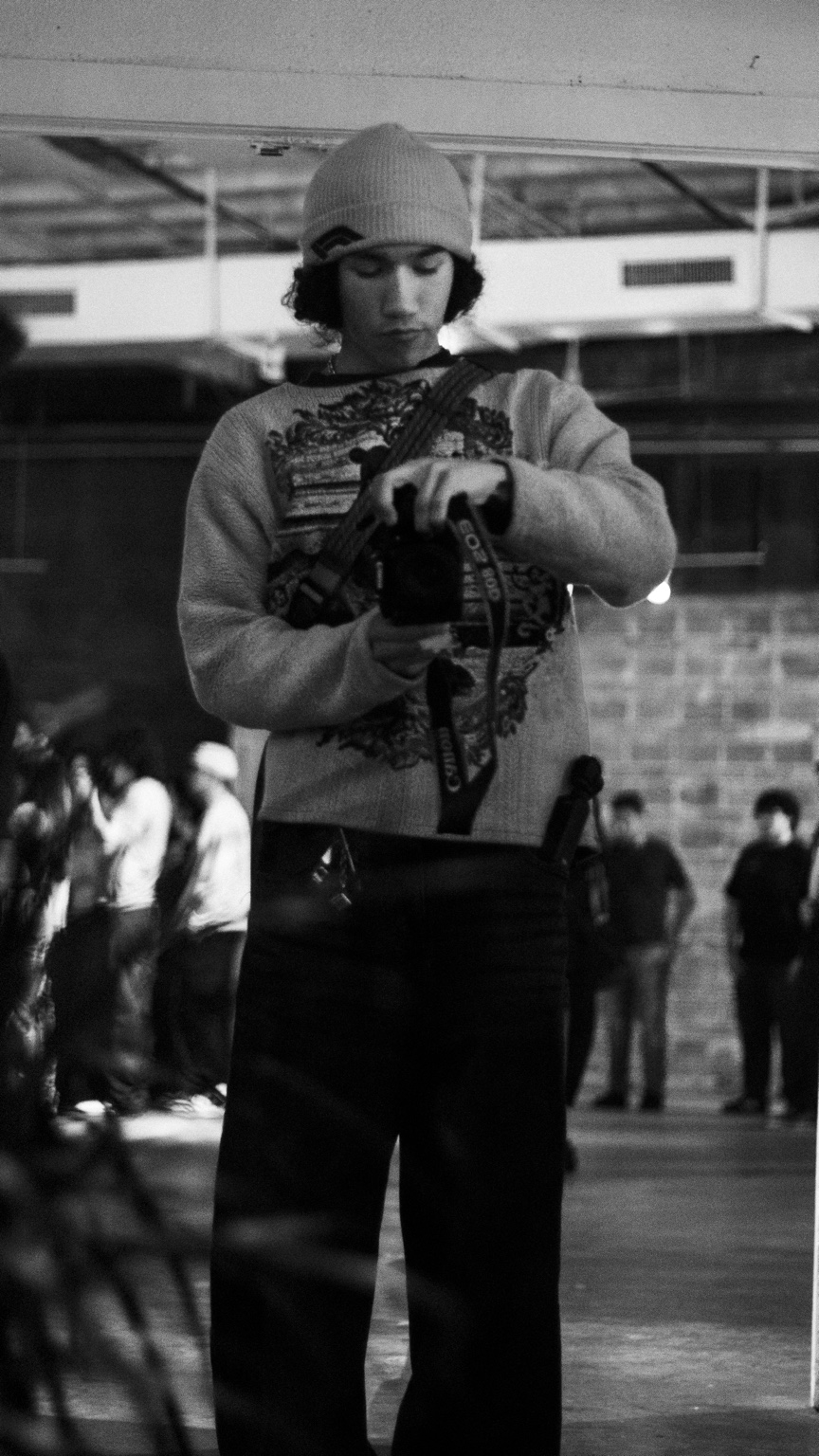 Almanza Studios photographer working with a camera
